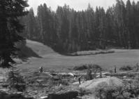 Starting work on ski house at Monroe Meadow. Ski run in distance.
