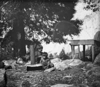Copy Neg: 1976 by J. Balckburn. Lena using a bowloom for making beadwork.