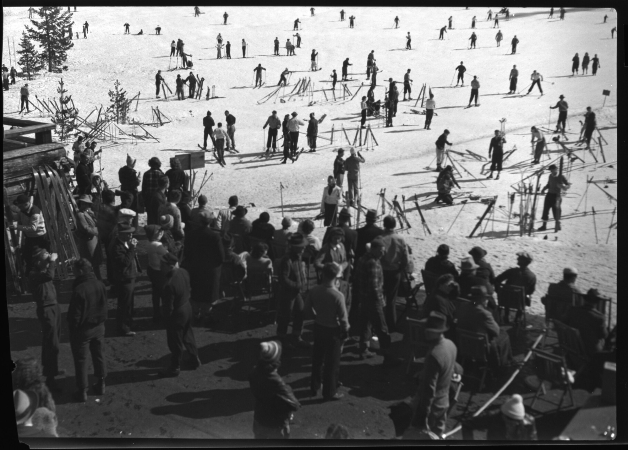 Badger Pass veranda with skiiers beyond