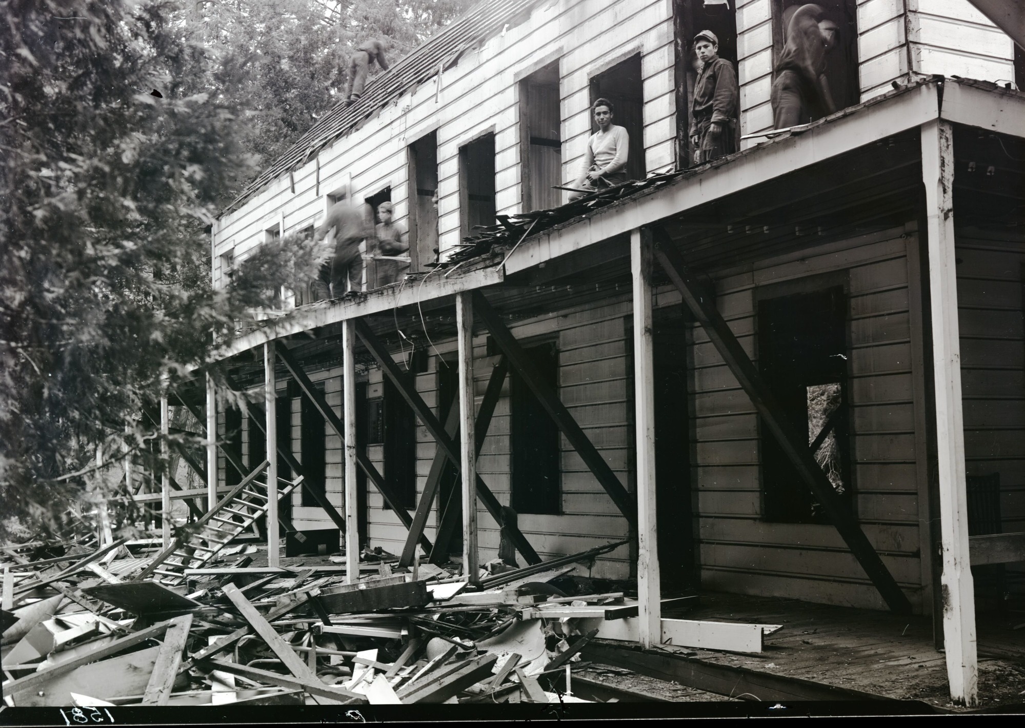 Tearing down old Cedar Cottage.