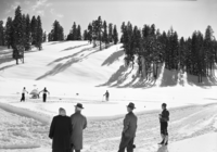 After record snowfall. In pictures are Mr. and Mrs. Arthur Demaray, recently retired Director of NPS; Mr. and Mrs. Wesley, landscape engineer of Region Four; Supt. Carl P. Russell; Ranger John Mahoney; E. C. Smith, park engineer; District Ranger buck Evans and his daughter Jeanie.