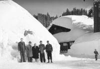 After record snowfall. In pictures are Mr. and Mrs. Arthur Demaray, recently retired Director of NPS; Mr. and Mrs. Wesley, landscape engineer of Region Four; Supt. Carl P. Russell; Ranger John Mahoney; E. C. Smith, park engineer; District Ranger buck Evans and his daughter Jeanie.