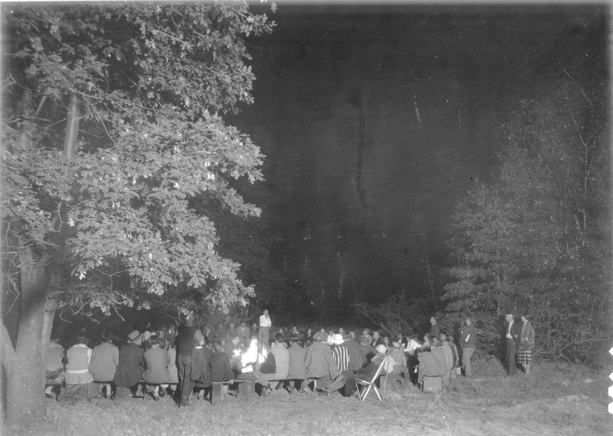 Tuesday evening camp fire in back of the museum. Class of 1926 in charge.