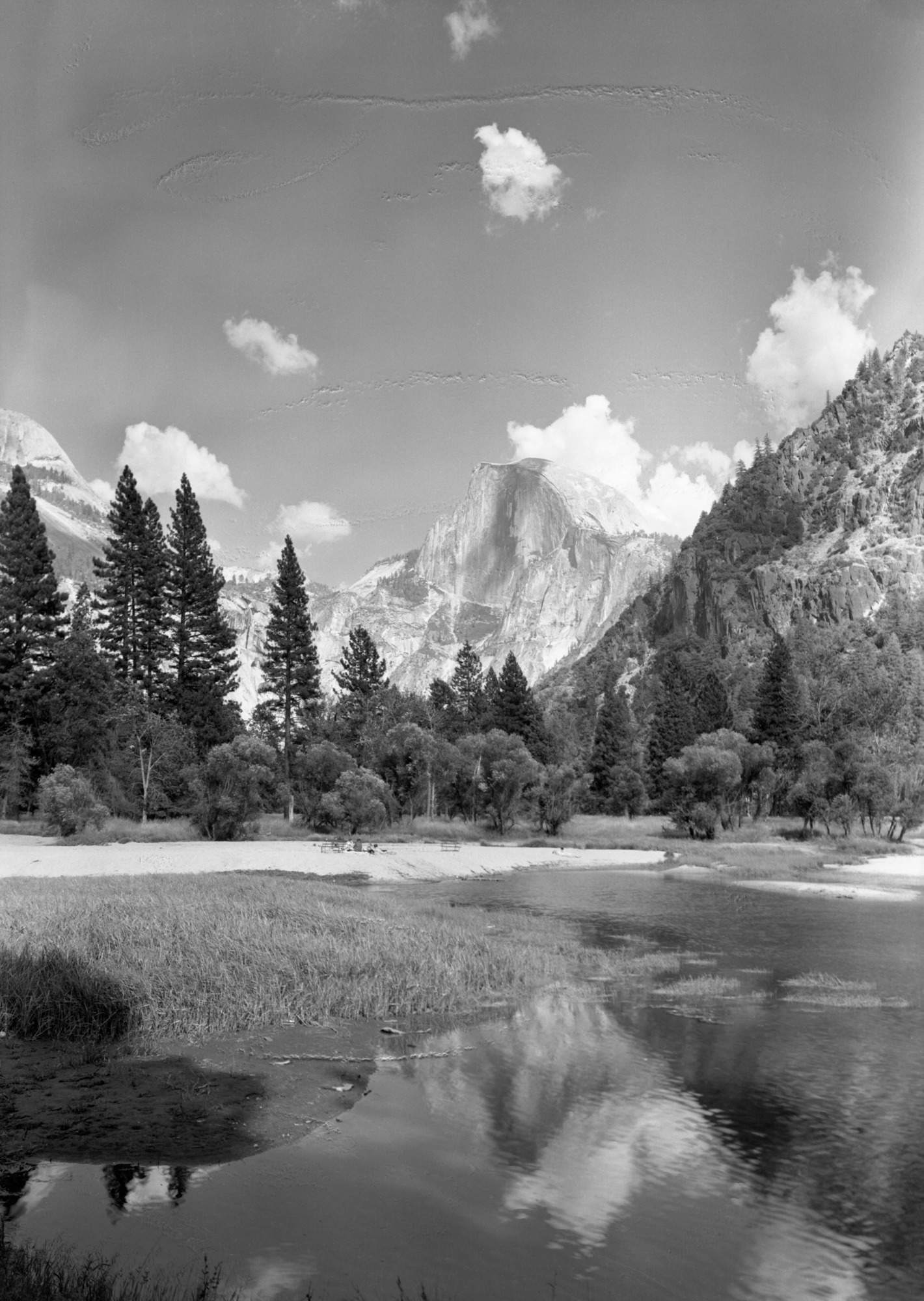 Half Dome & people on beach near Lodge.