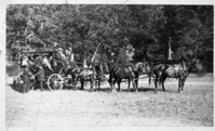 Horse drawn stage in front of Yosemite Valley Chapel. Six individuals identified: Barnard, Caufman, Sinning, Guy, Joe Mellyn, and Mrs. Barnard. (The spelling on the print of the individuals name may be interpreted differently).