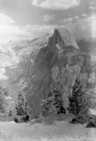 Half Dome & Clouds. Miss Schmidt of The Washington office in foreground. Copy Neg: 1995, Leroy Radanovich.