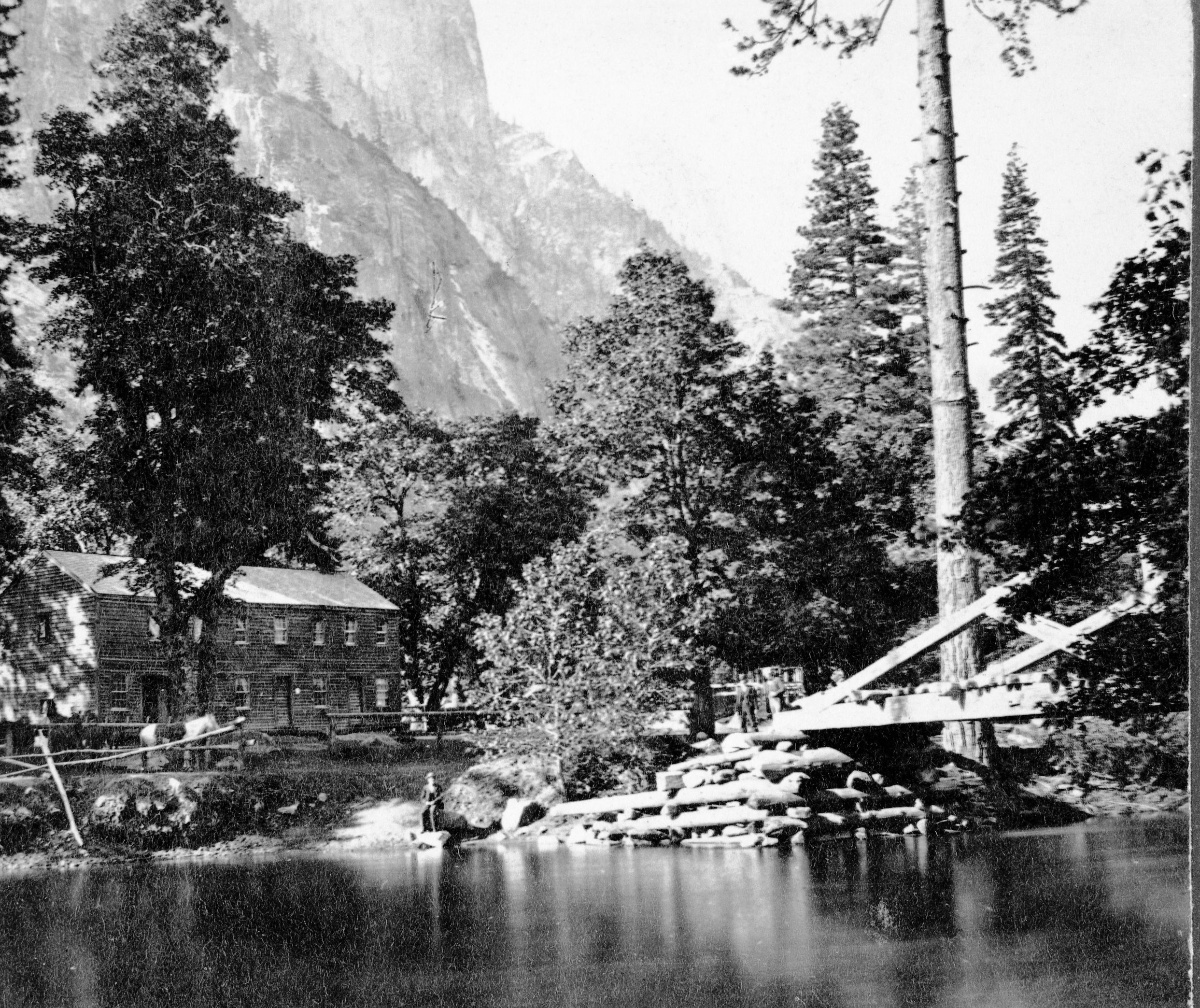 Detail of L. Samus Stereo (RL-16,548). Caption: "1621. Sentinel Rock, 3,270 feet high, Hutchings' Hotel, and the Merced River." copied by Michael Dixon, copied July 1985