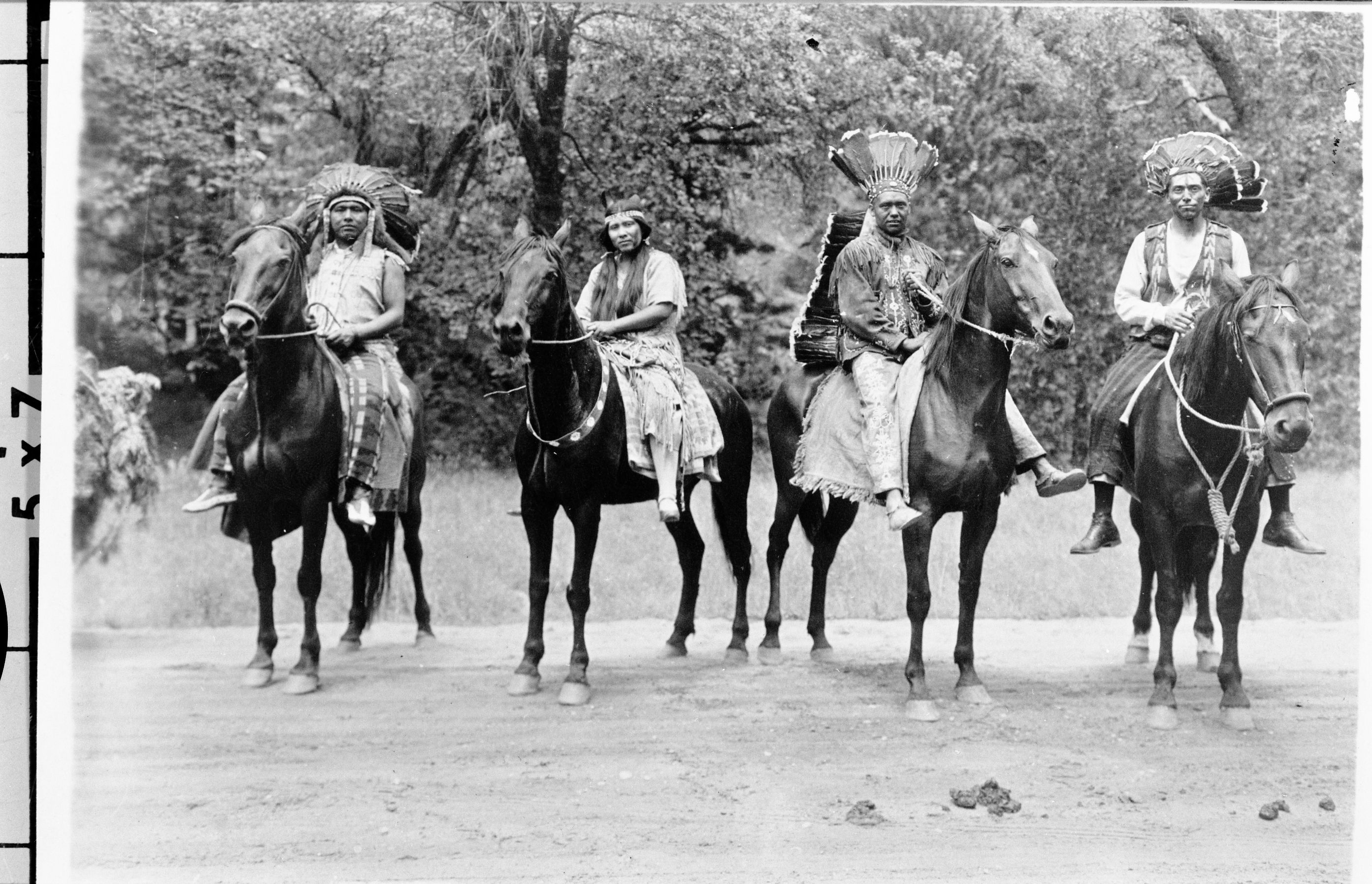 Copy Neg: 1985 by M. Dixon. Indian Field Days. L-R: Chris Brown and 3 unidentified people. Pants on man 2nd from right in Mariposa Historical Society Collection.