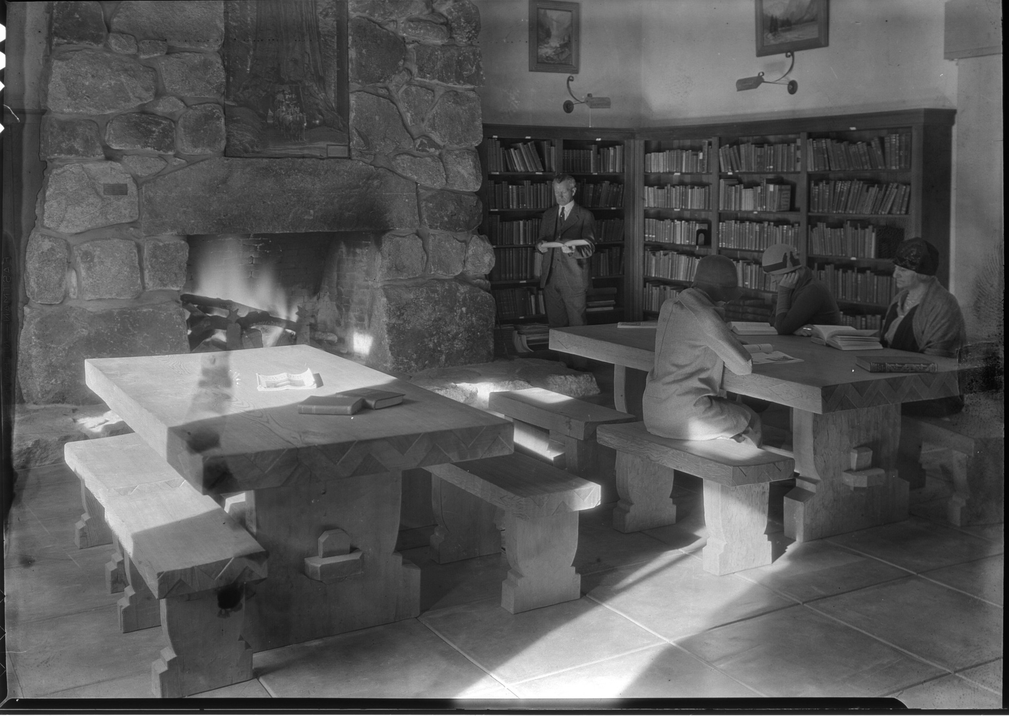 Museum Library. C.A. Harwell, Park Naturalist, at the shelves