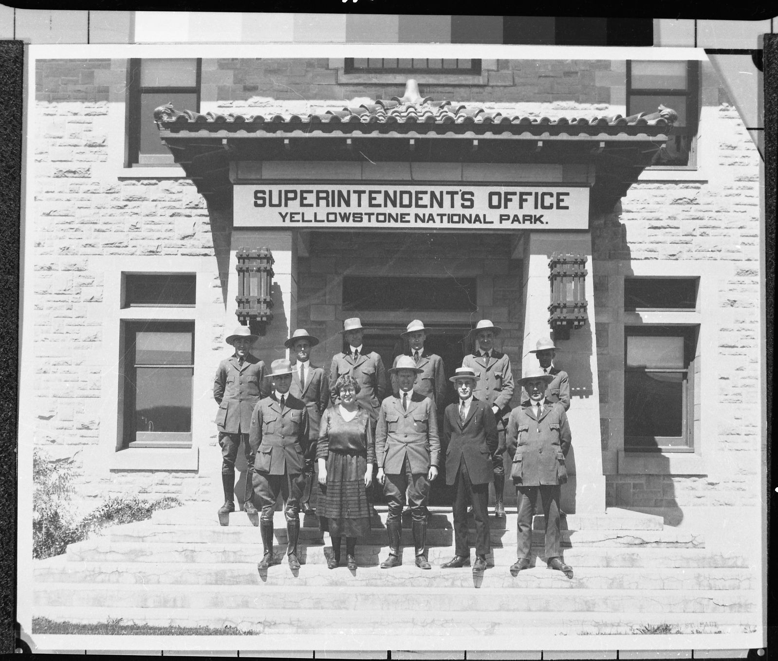 Copy Neg: J. Ernest, 1983. (L-R) Top Row: Joe Joffe, _______, Levitt, ______, ______, ______. Bottom Row: Mr. Lewis, Julia Woodring, Mr. Albright, ______, ______ at the Supt. Office in Yellowstone National Park. Original print in the over-sized photo drawer in RL.