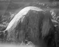 Aerial photograph of Half Dome from flight over park.