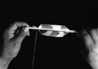Le-me feathering an arrow.
