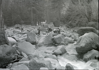 CWA men clearing channel of Yosemite Creek; Showing stream bed with rock partially removed.
