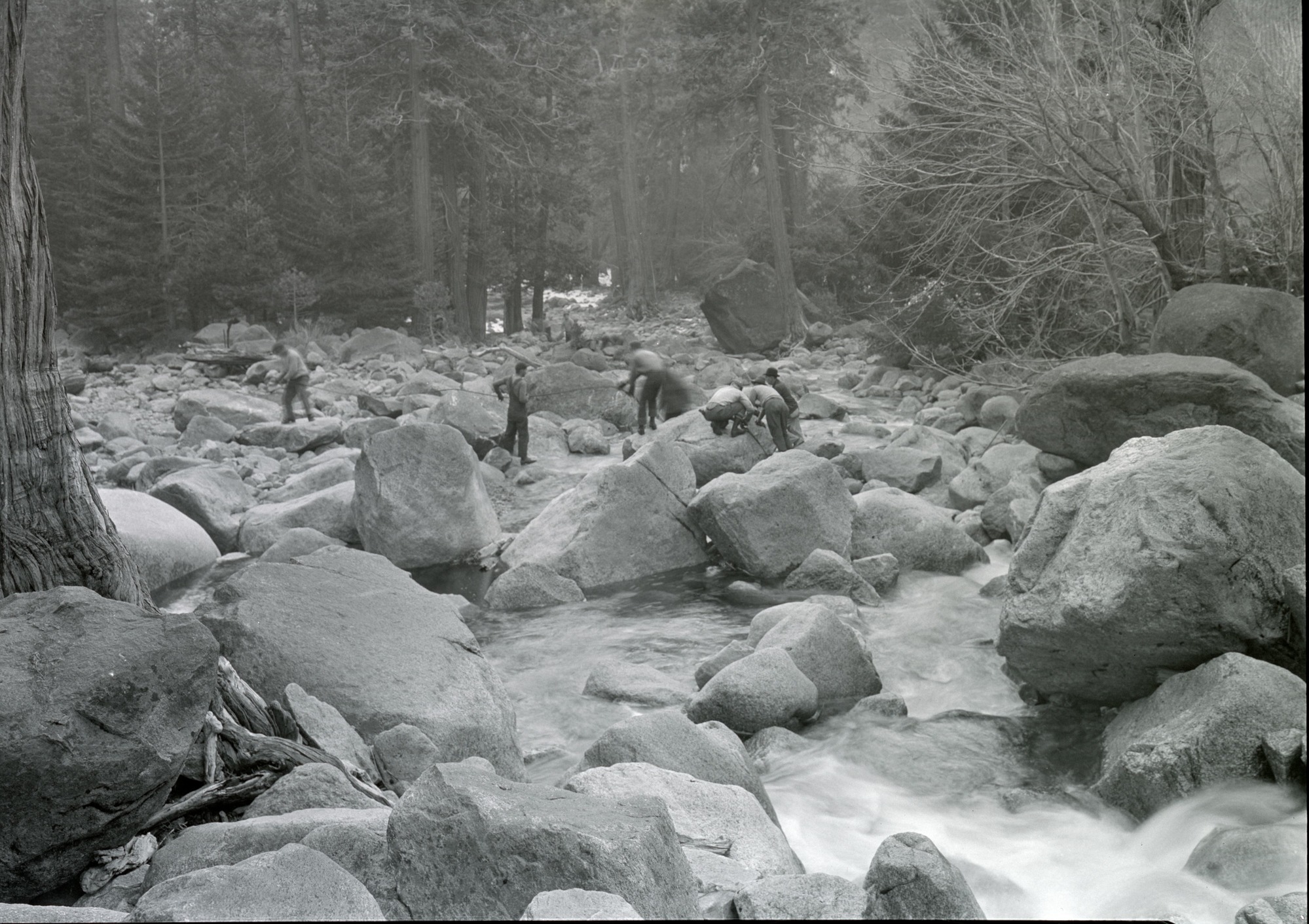 CWA men clearing channel of Yosemite Creek; Showing stream bed with rock partially removed.