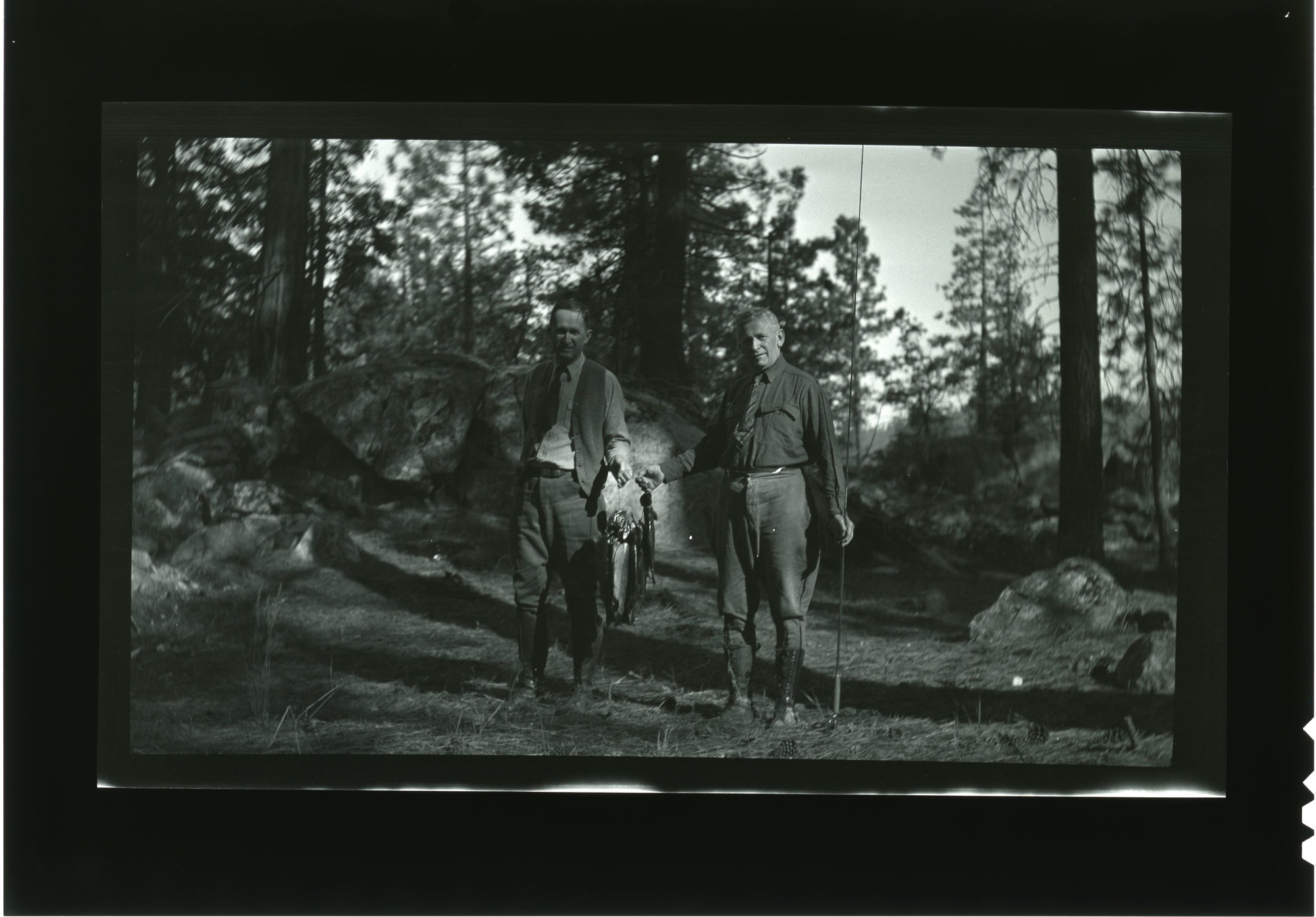 Horace Albright (left) and Gov. Young- fishing trip.