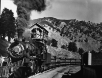 Log train #26 at Bagby. Engine #26 built by alco in 1924 - in Cabken? Munson. Last year of log train run from El Portal to Merced Falls. copied February 10, 1961