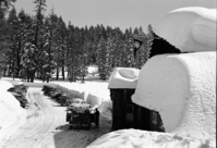 Skiers arriving at Badger Pass ski house.