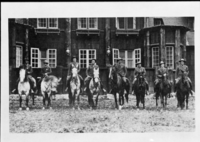 Mounted Rangers at Rear of Ranger's Club. [Far right: Chief Ranger Forest Townsley, 5th from right: Charles Adair (?), 2nd from left: Billy Nelson (?), Far left: Jack Gayler (?)]