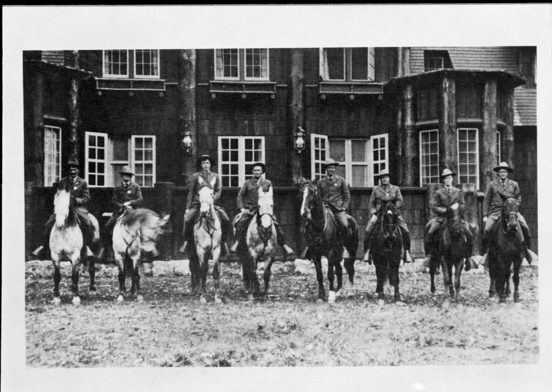 Mounted Rangers at Rear of Ranger's Club. [Far right: Chief Ranger Forest Townsley, 5th from right: Charles Adair (?), 2nd from left: Billy Nelson (?), Far left: Jack Gayler (?)]