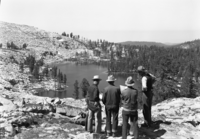 Hilton, Kittredge, Plumb & Mernin study the contour map while looking out over Buena Vista Lake.