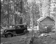 Foresta. Wall house, temporary shack with wreckedn Chevrolet car near Myers line. A-10.