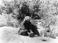 Old Lucy (Lucy Brown) pounding acorn.