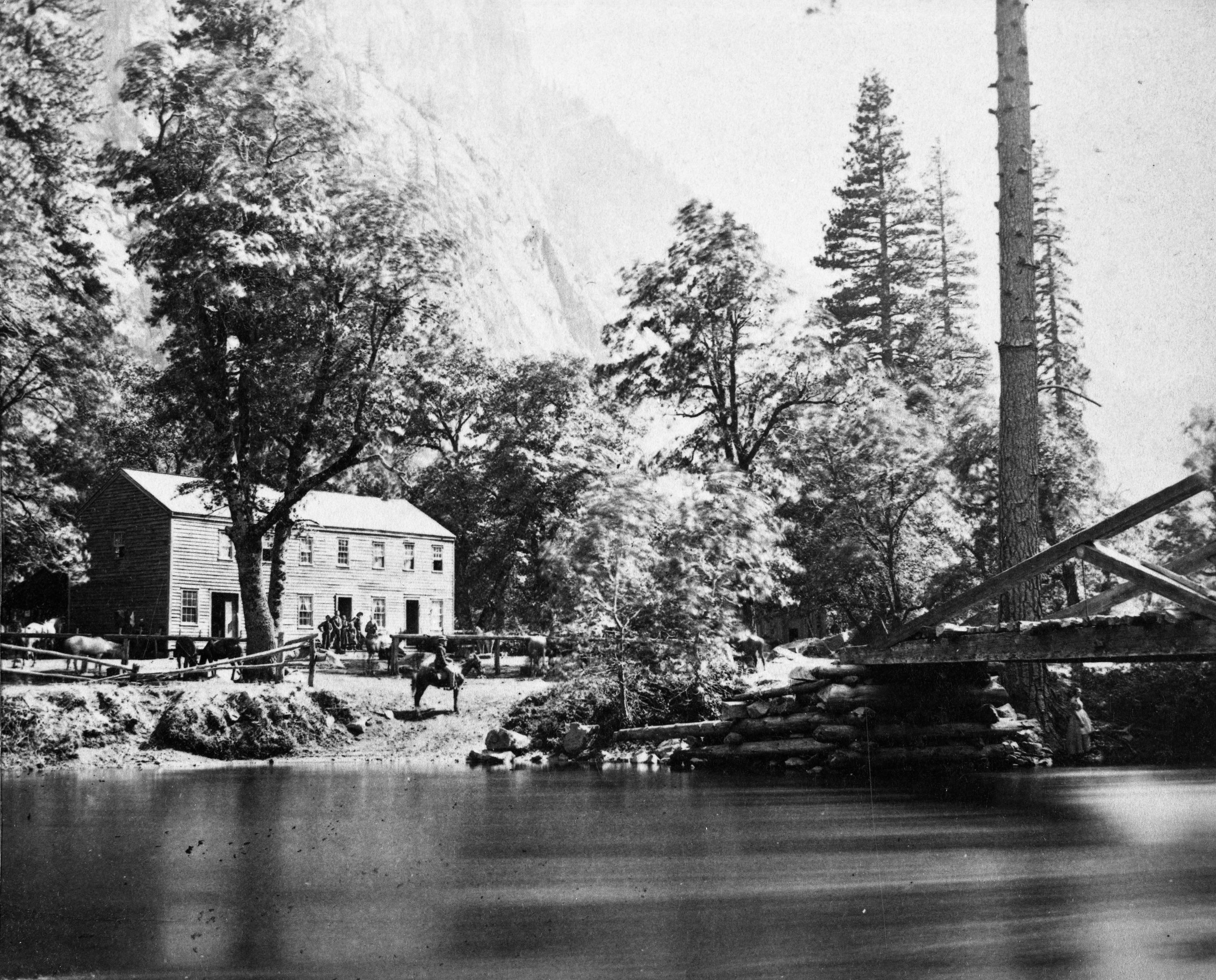 Detail of L. Smaus stereo (RL-16,552). Written on back of card: "Yosemite Valley. the Sentinel and Hutchings Hotel. June, 1870. On horse. H.C.T." copied by Michael Dixon, copied July 1985