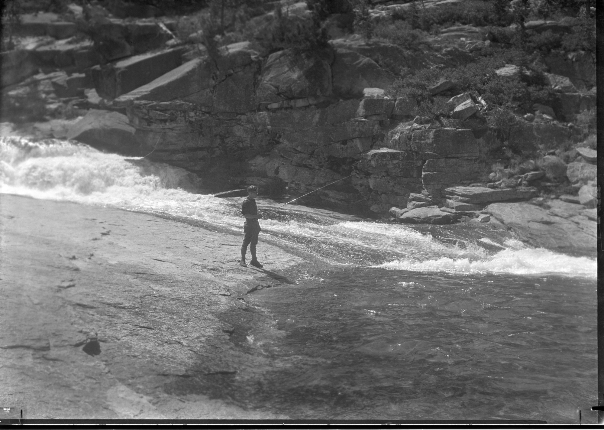 Arnold Williams fishing in the Merced River near Merced Lake.