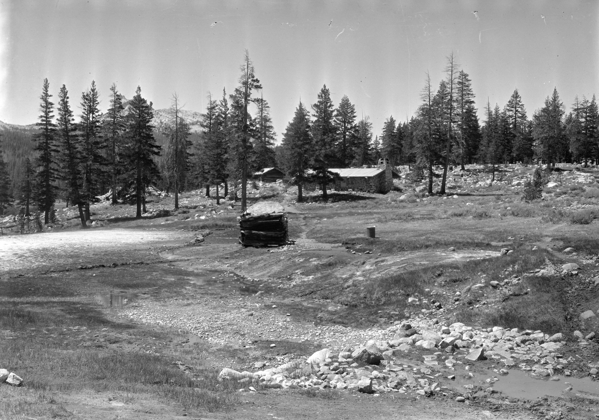 Private Lands Study. Sierra Club Property: View of lodge-pole timber in the background; McCauley Cabin, Parson's Lodge, and Soda Spring enclosure in the middle foreground, view about seventy-five degrees west of south.