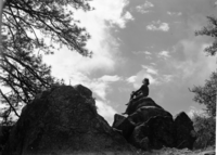 Girl on cloudy skyline