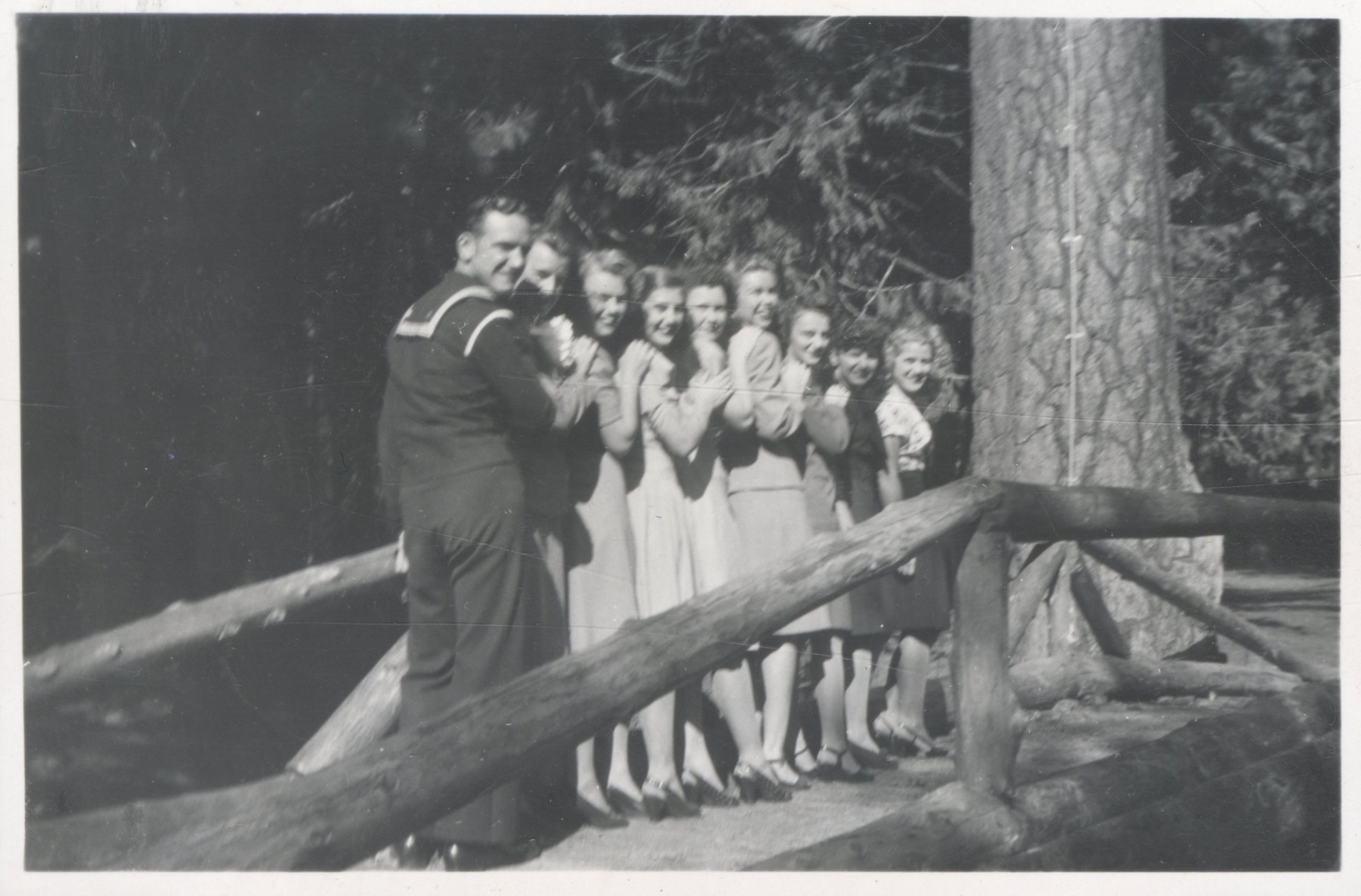 Ed Mathews and eight others pose on a bridge