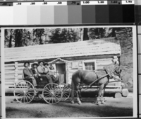 Sam & Ida Hogan in back seat. Bert & Rose Smith and Mildred in front seat. In front of the Mariposa Grove cabin. Copied courtesy of Harold Hogan, 1984.