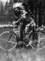 Chris Brown riding a bicycle.