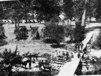 Copy Neg: 5/91, Denise Guidi. Camp A. E. Wood, Wawona. Gabriel Sovulewski seated on the bridge, lower left.