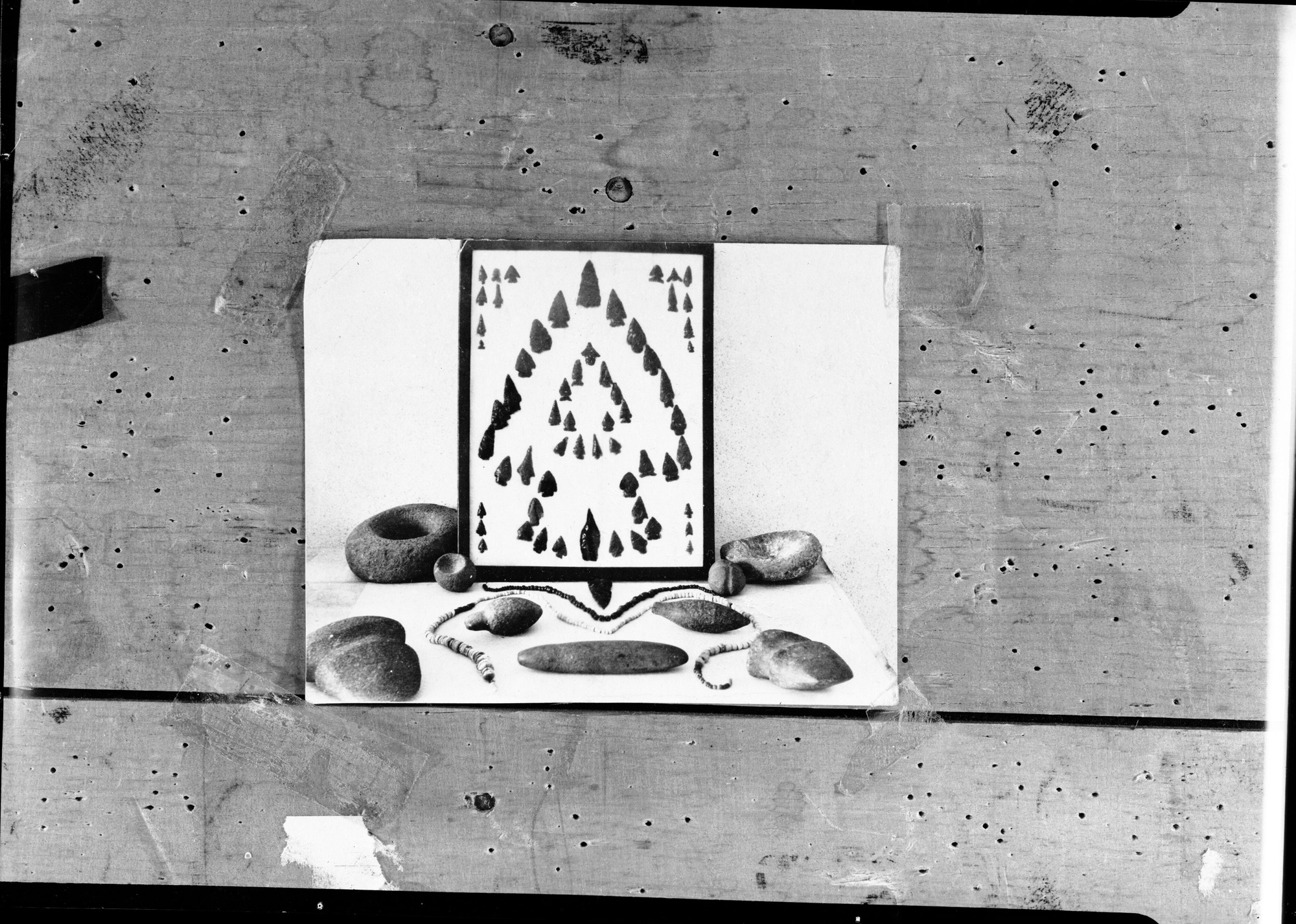 Copy photo of Indian artifacts taken in effort to locate missing mortar