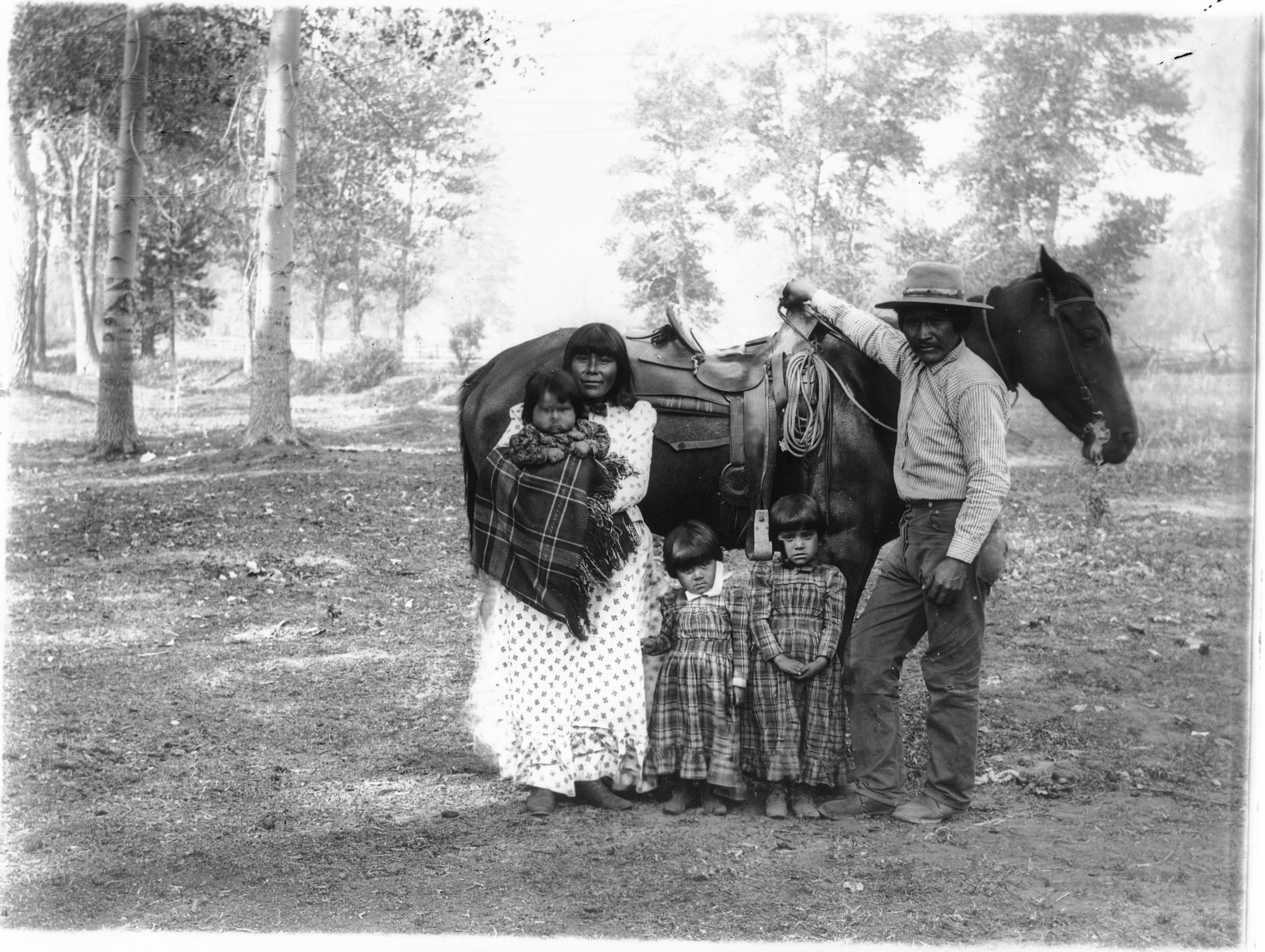 [This is Bridgeport and Leanna Tom & their family - CIOB and MJL 1998]. "Piutes from Mono Lake in Yosemite for acorns. . . . Stay 3 or 4 weeks and gather several bushels and go out over the Yosemite Falls trail." Original in the YNP Collection. [This is Paiute Bill and Suzie McGowan with Sadie (baby), Carrie (left) and Minnie - Dean Tonenna (grandson of Sadie McGowen) 8/7/2014].