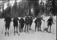 Ski party: L-R Chief Townsley, O.G. Taylor, Chas Adair, Dick Freeland, John Wegner, ?, Carl Russell, Sam Clark [attached to photo card] Stone Photo: Off for the High Sierra! This party insisted on penetrating the depths of the High Sierra even when blanketed with snow averaging from seven to eleven feet in depth. Skiis and snowshoes are the prevailing means of transportation in the High Sierra region surrounding Yosemite Valley after the snow begins to fall. From James V. Lloyd, Information Ranger, Yosemite National Park, Calif. Copy Neg: Leroy Radanovich, February 1998