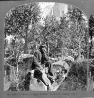 Copy Neg: 7/85 by M. Dixon. Detail of L. Smaus stereo (RL-16,581). Caption: "No. 469 - Yosemite Digger Indian, Yosemite Valley, Cal." Yosemite Fall in background. "Curious mocassins" - C. Bates. Published as "last Yosemite Indian" but not true.