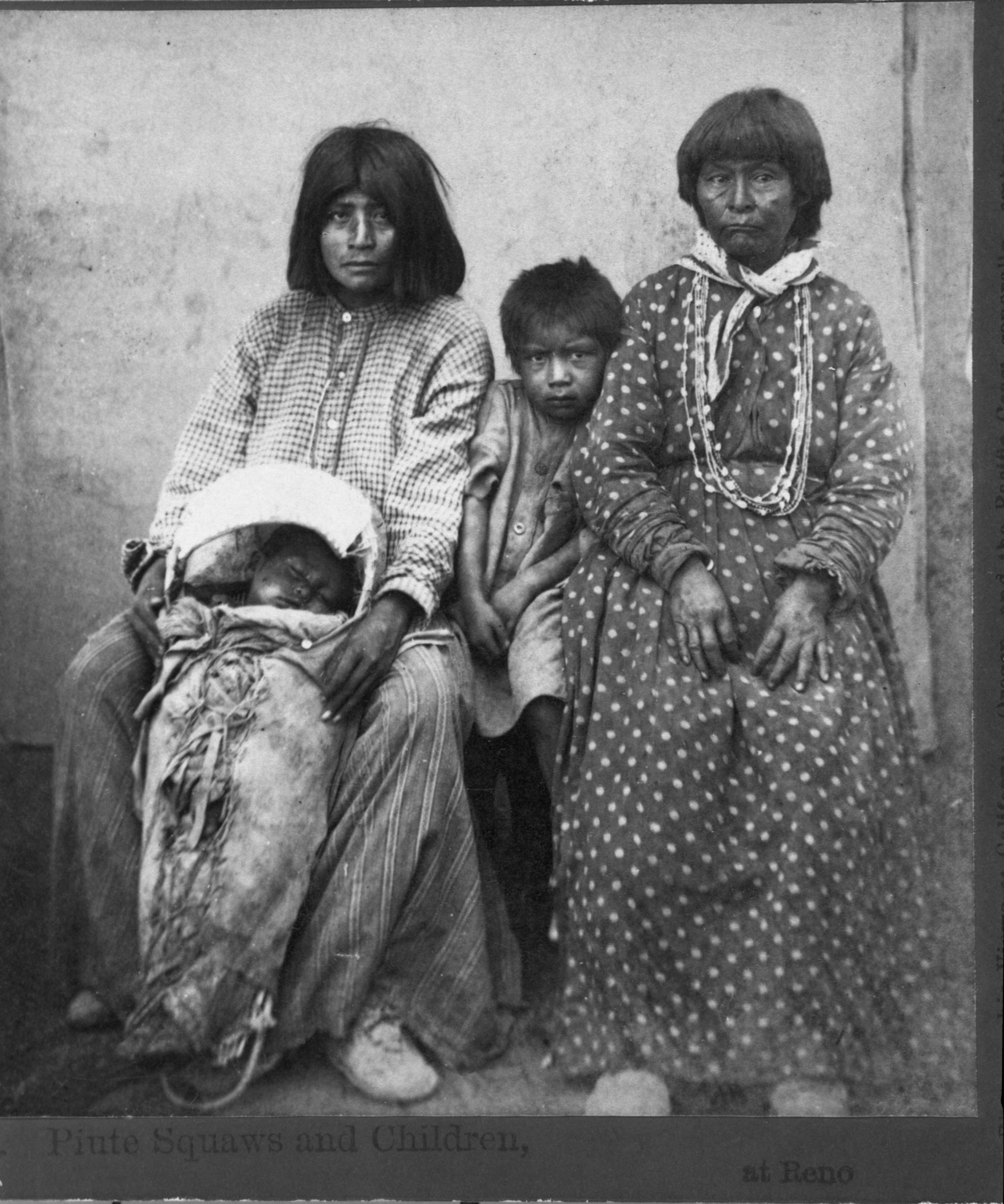 Copy Neg: 7/85 by M. Dixon. Photogr: Watkins' Pacific Railroad. Detail of L. Smaus stereo (RL-16,573). Caption: "Piute Squaws and children, at Reno."