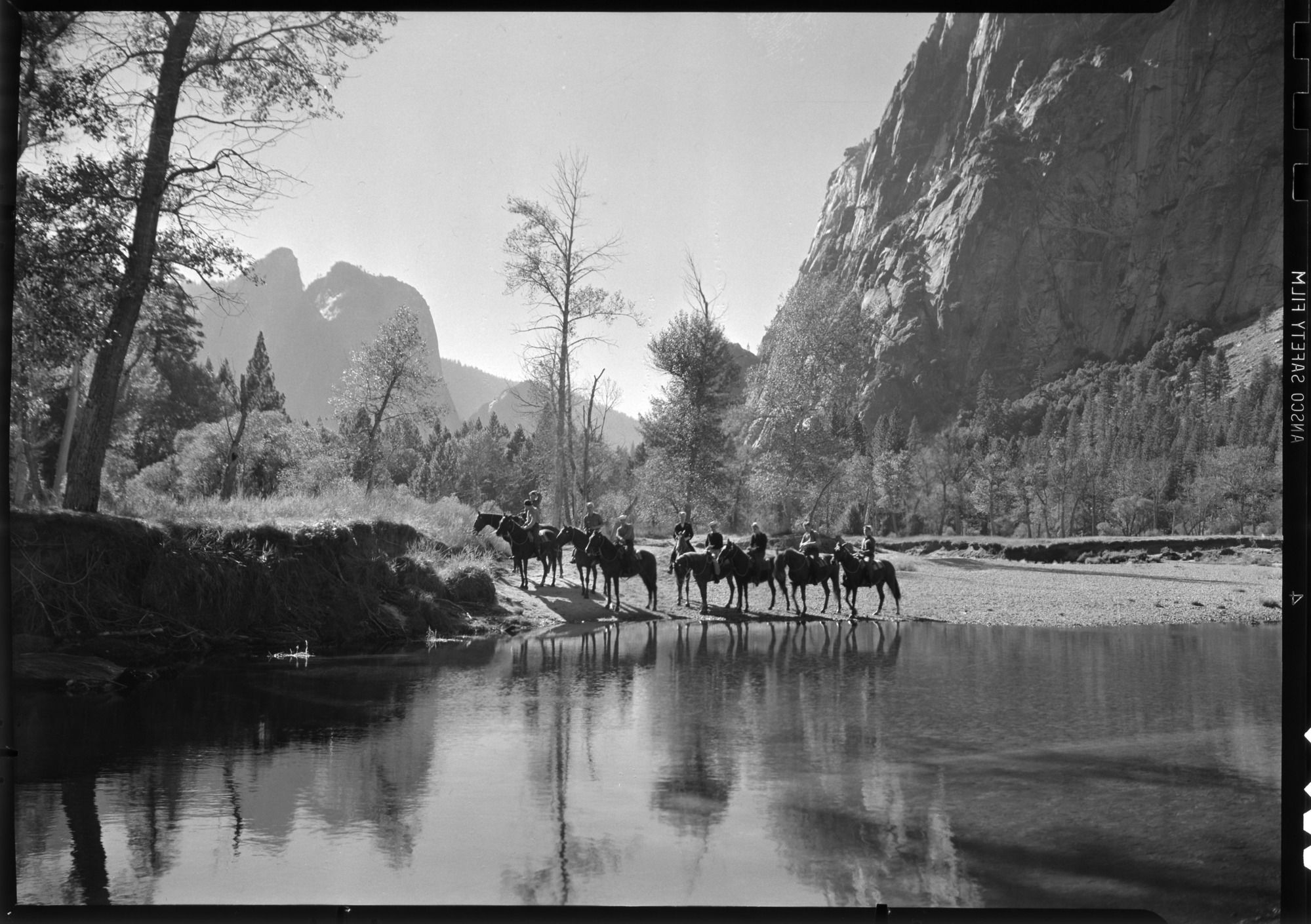 Sailors on horseback with Cathedral Rocks in background.