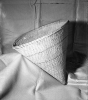 Soap-root glue-coated burden basket. Purchased in Wawona from Suzie in 1906 by S. A. Barrett. Black bands of bracken fern root. c. 55cm. In the Lowie Museum of Anthropology, U.C.B. Cat. #1-10,239