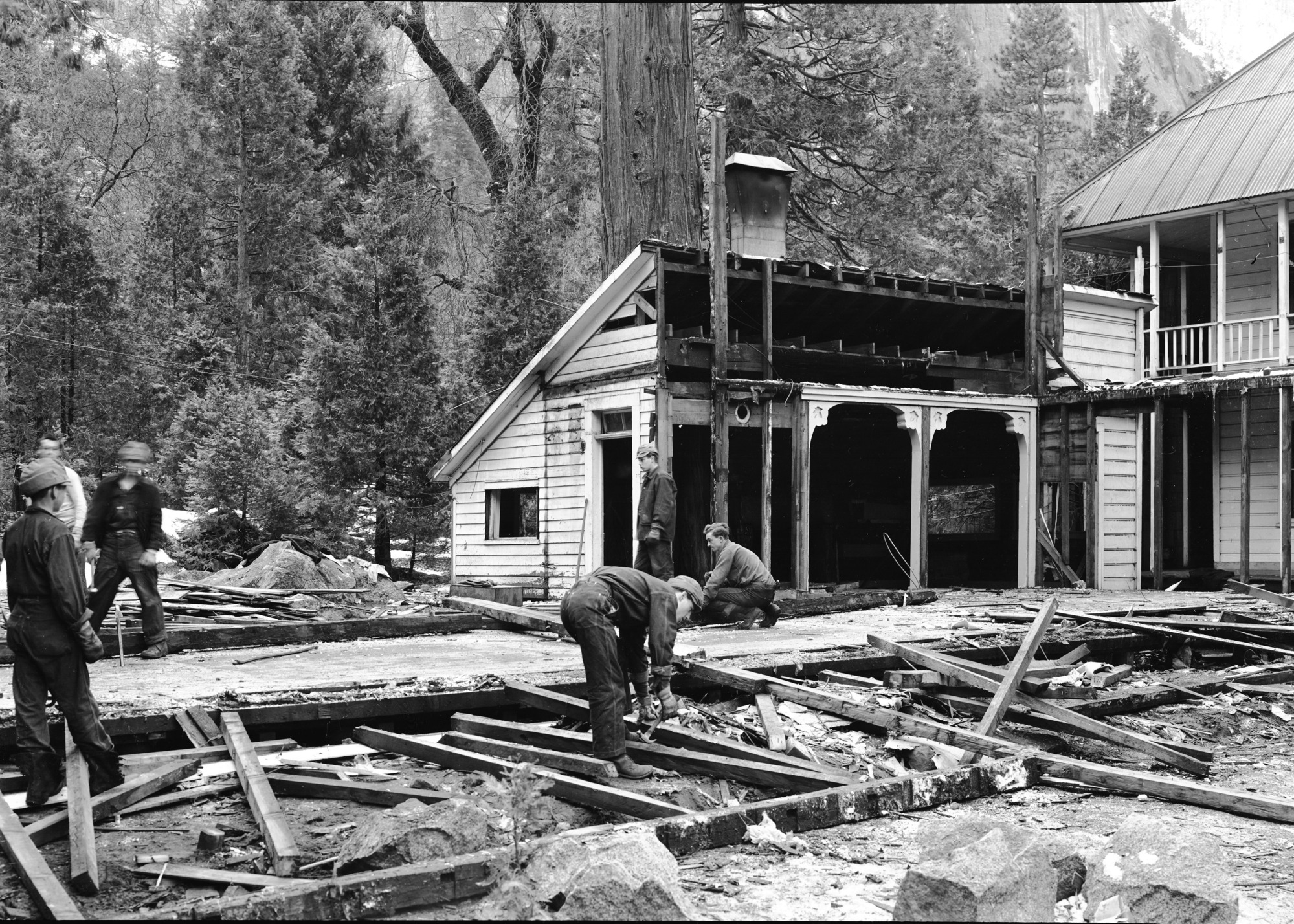 Tearing down Cedar Cottage.