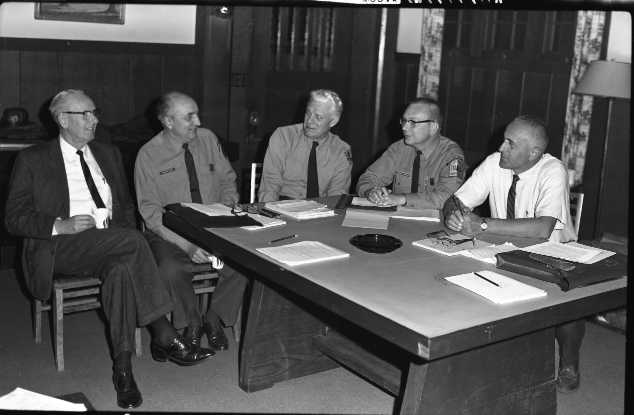 USFS - NPS Interagency meeting at Yosemite's Rangers Club: Area Managers Discuss Common Problems on National Forests & National Parks. L to R: John M Davis, Supt. Sequoia-Kings Canyon NP; Walter J. Puhn, Spvsr. Sierra NF; John C. Preston, Supt. Yosemite NP; Lawrence M. Whitfield, Spvsr. Sequoia NF; Joseph T. Radel, Spvsr. Inyo NF. Harry Grace, Spvsr. Stanislaus NF was absent.