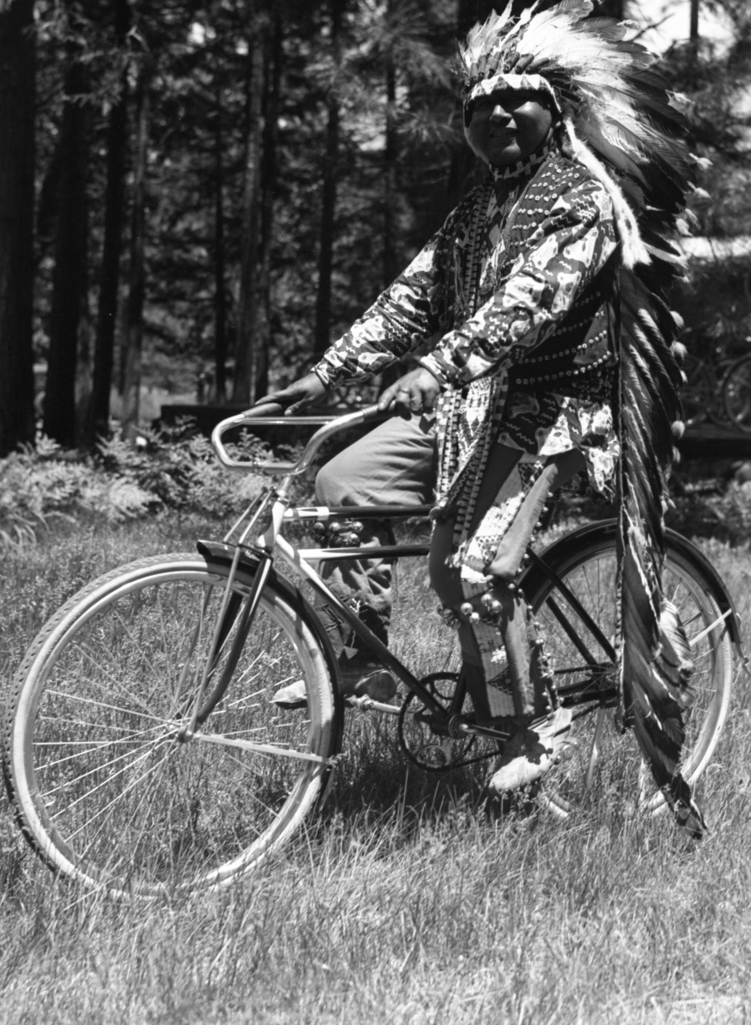 Chris Brown riding a bicycle.