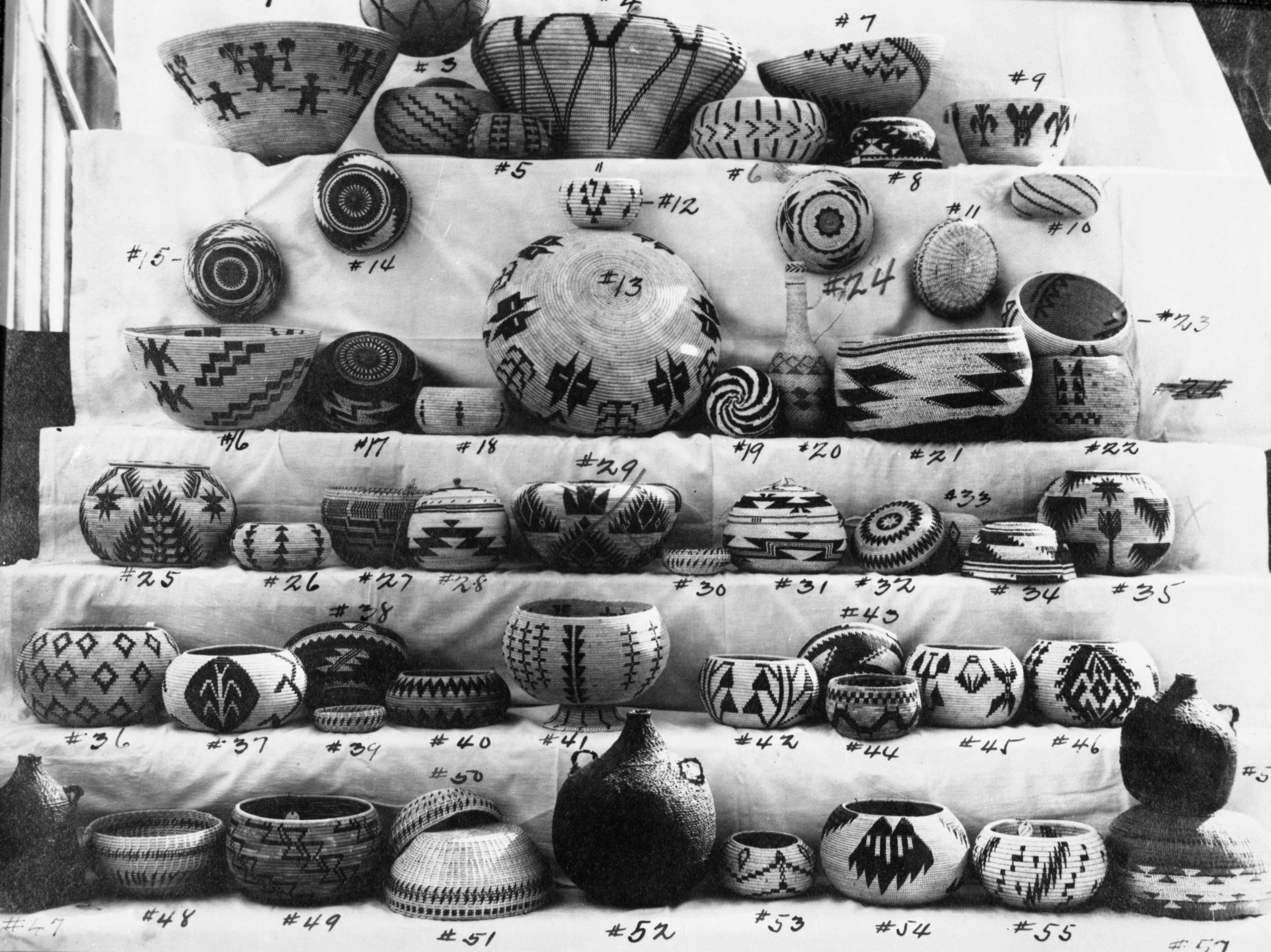 Sales photo of baskets at Salter's store, Yosemite. #6 & 10 by Lucy Telles, now at Field Museum of Natural History, Chicago. #25, 29, 35 also by Lucy Telles. #25 in YNP Collection.