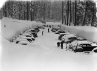 Heavy snow at Badger Pass and snowplows.