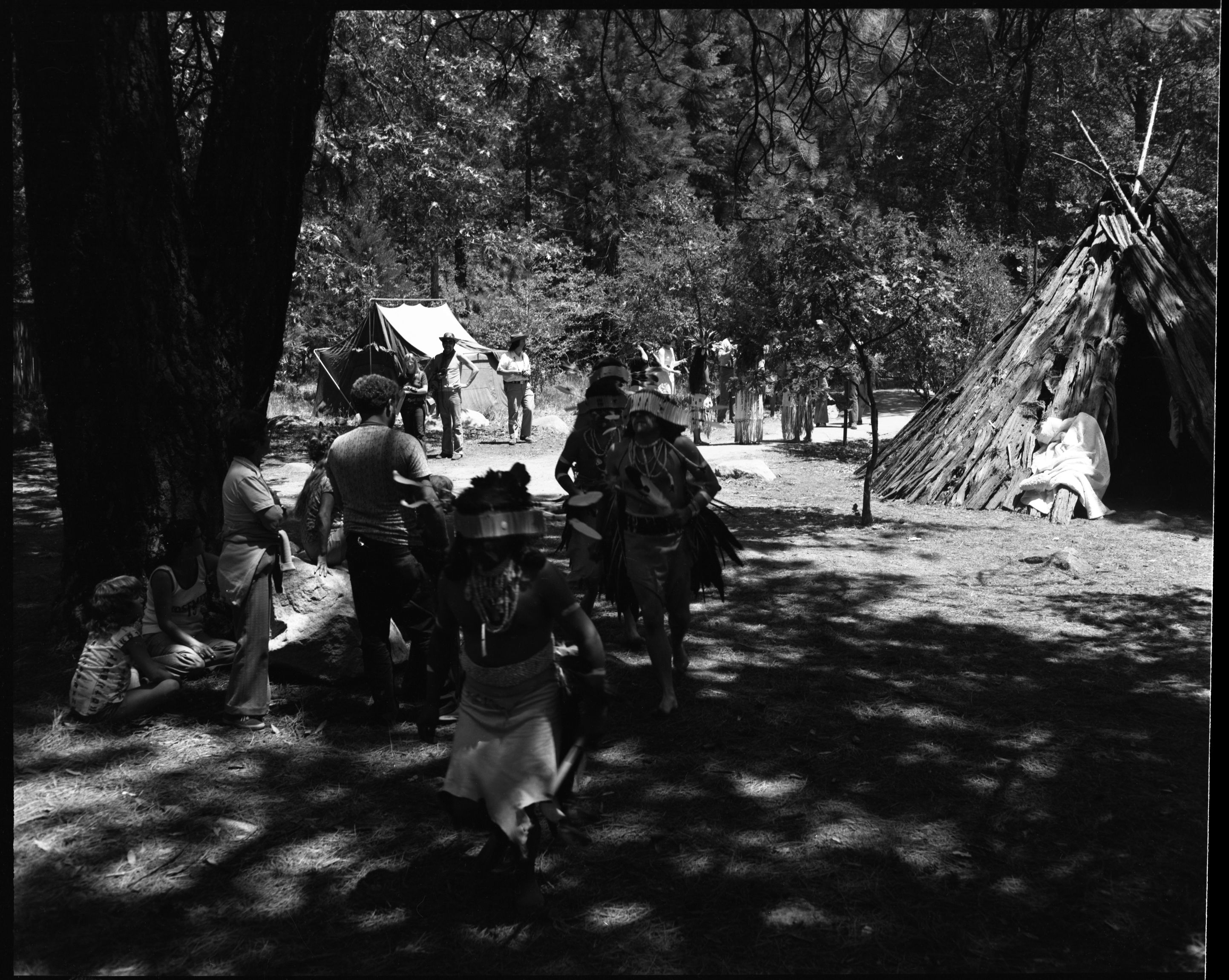 Maidu dancers approaching the Roundhouse, Yosemite Roundhouse Dedication. Front to back: Frank LaPena (Wintu), Craig Bates, others unidentified.