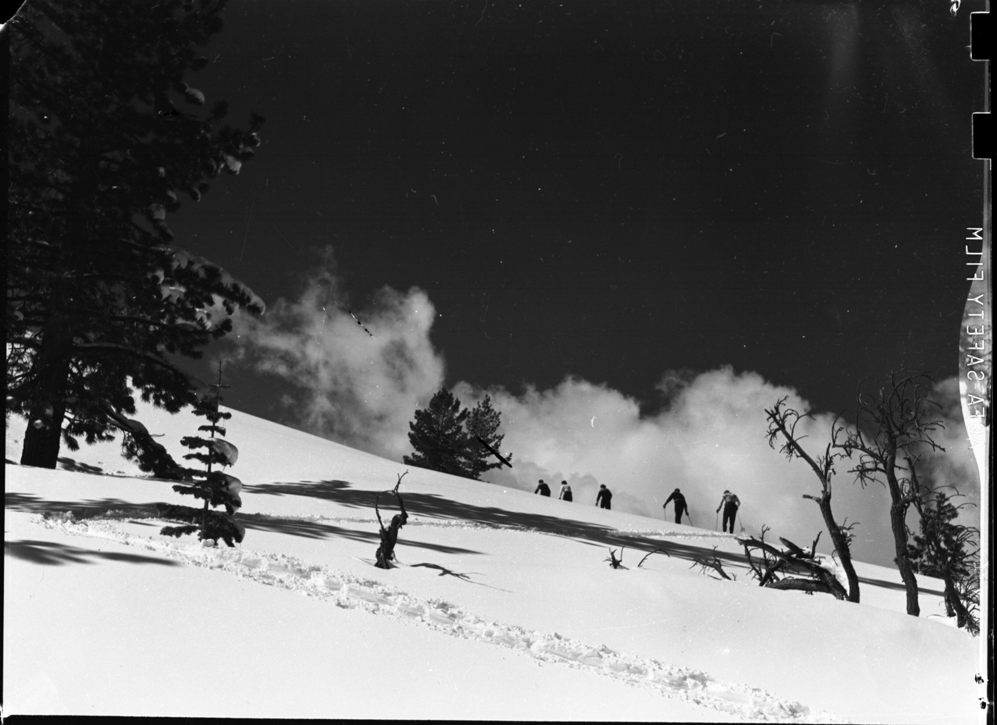 Jack Kuhne packing heavy camera on snowshoes