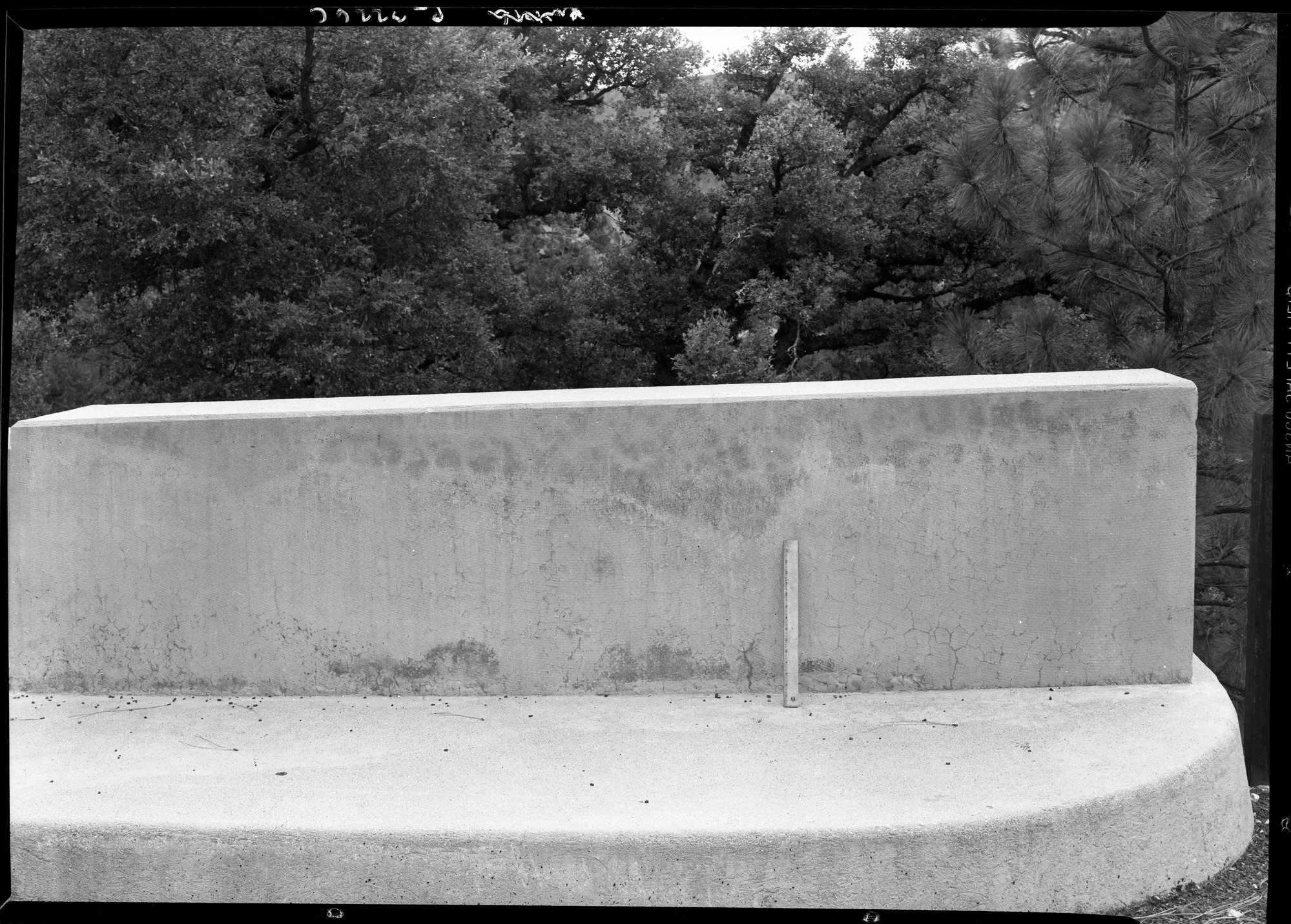 Concrete on bridge over Wildcat Creek on Big Oak Flat Road, showing checking in progress.
