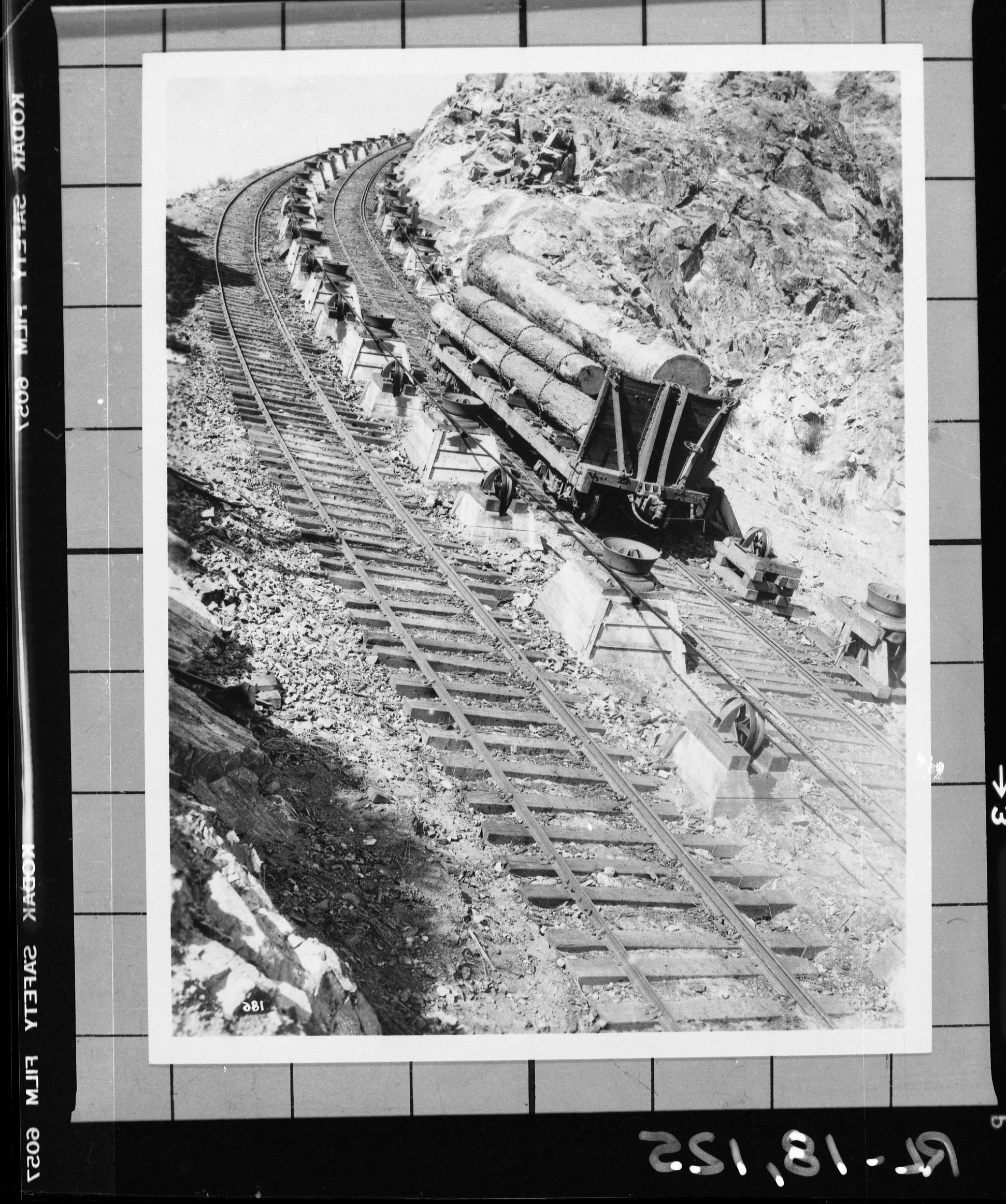 Copy Neg: 1983, J. Ernest. Loaded log car No. 884 descending second incline. Page 59 in Hank Johnston's "Shortline to Paradise". Fron the negative file of Al Rose. [Reversed - original seen - 5/19/16 NJR]